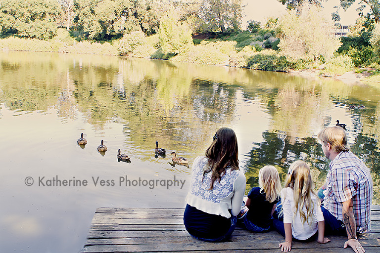 family watching some duckies swim by in Davis, CA