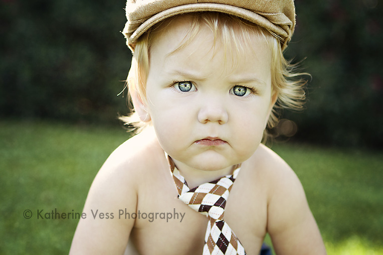 adorable baby boy in tie and newsboy hat