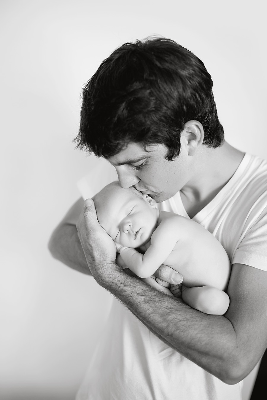 sweet daddy and newborn boy