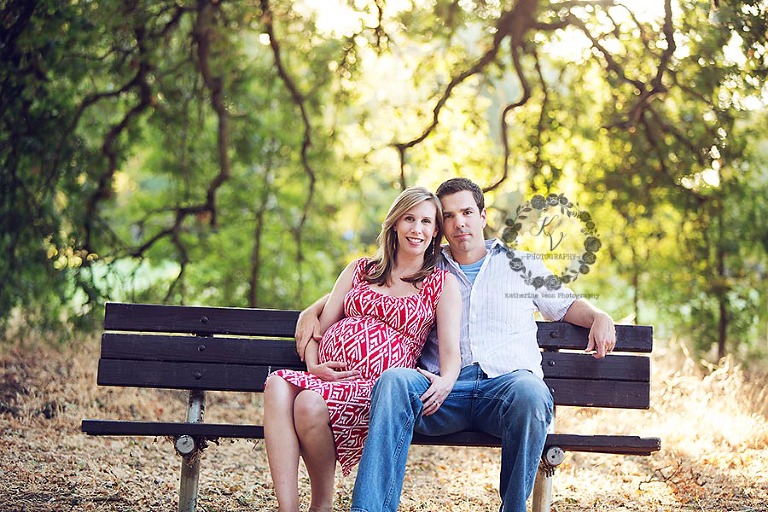 maternity couple on a bench