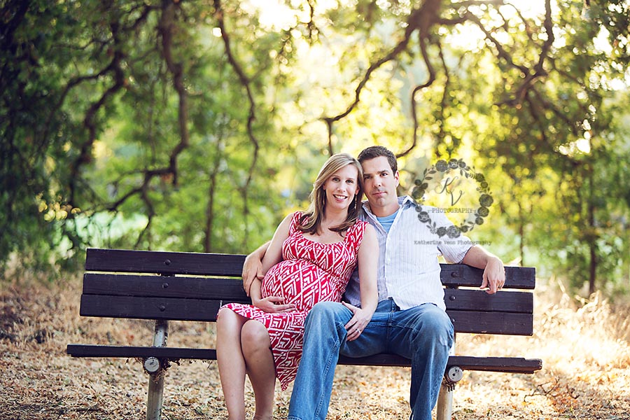 maternity couple on a bench