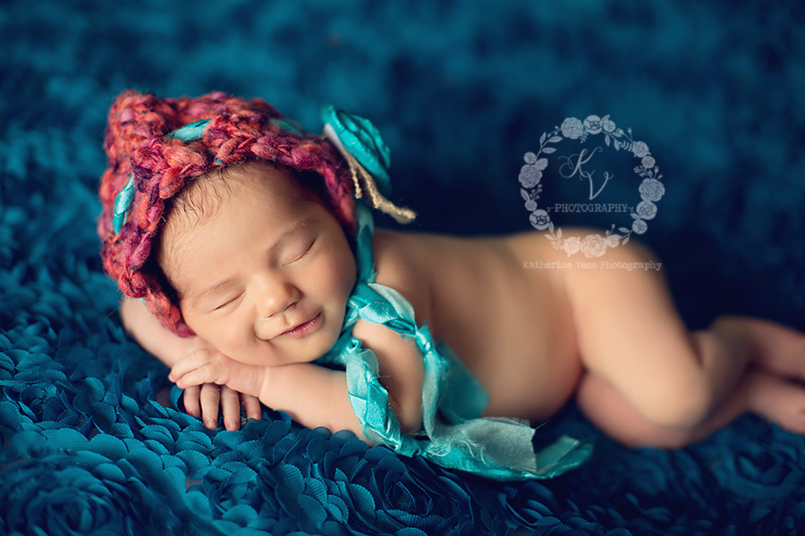 newborn girl smiling