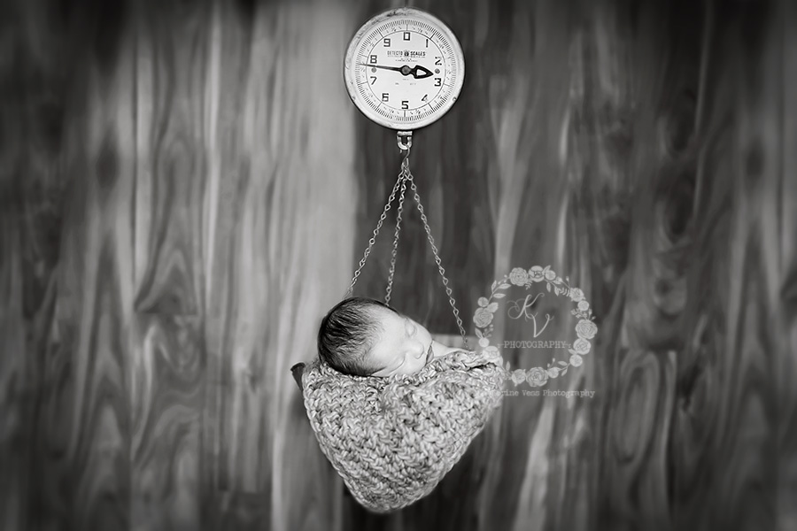 newborn in scale