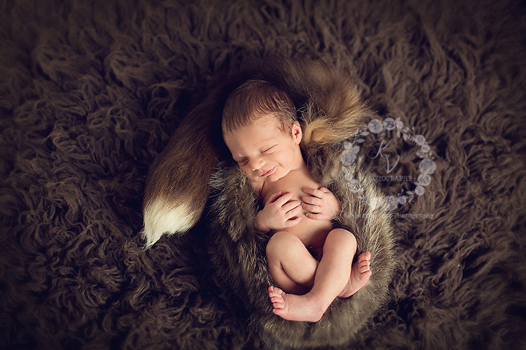 newborn in davie crocket hat