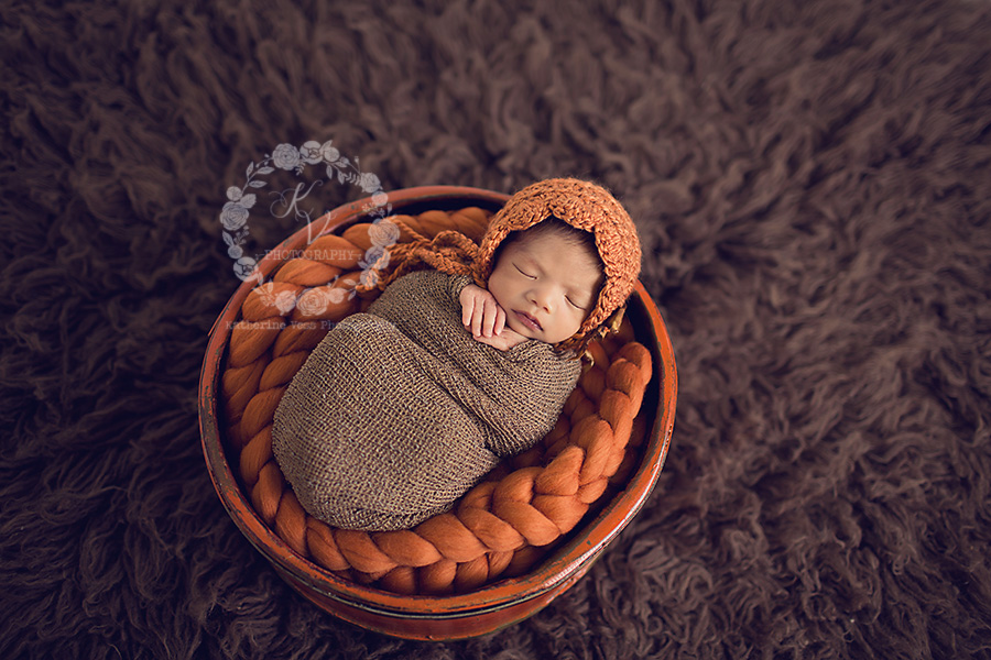 baby girl in orange and brown