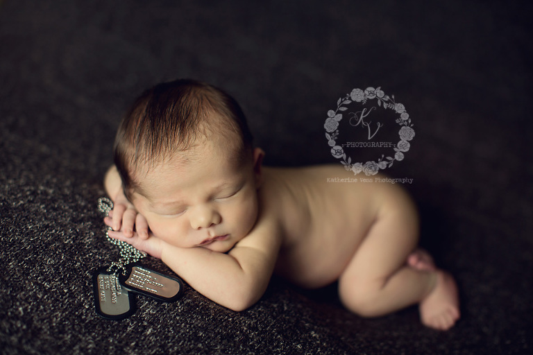 baby with dog tags