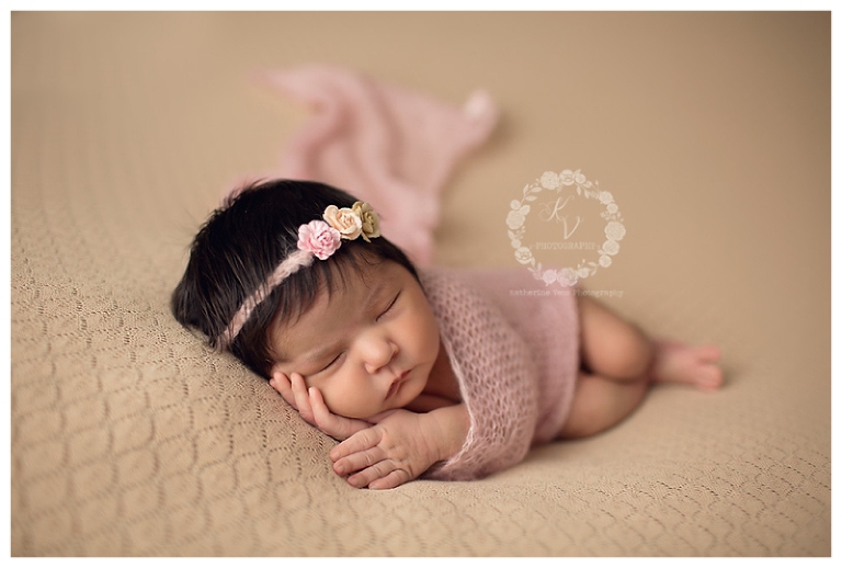 newborn baby girl wrapped, perfect side laying pose