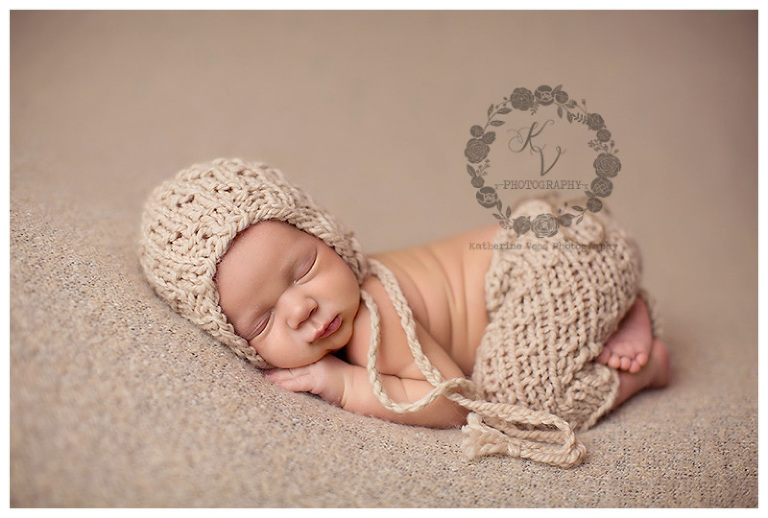 newborn in pants and bonnet, neutral setup