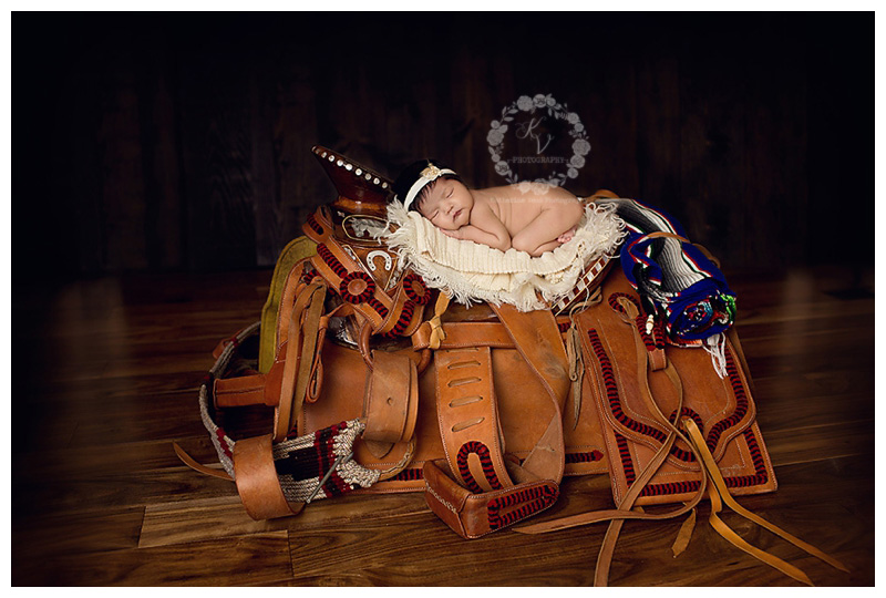 newborn on saddle