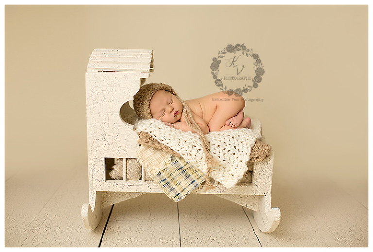 baby boy in cradle, cream setup