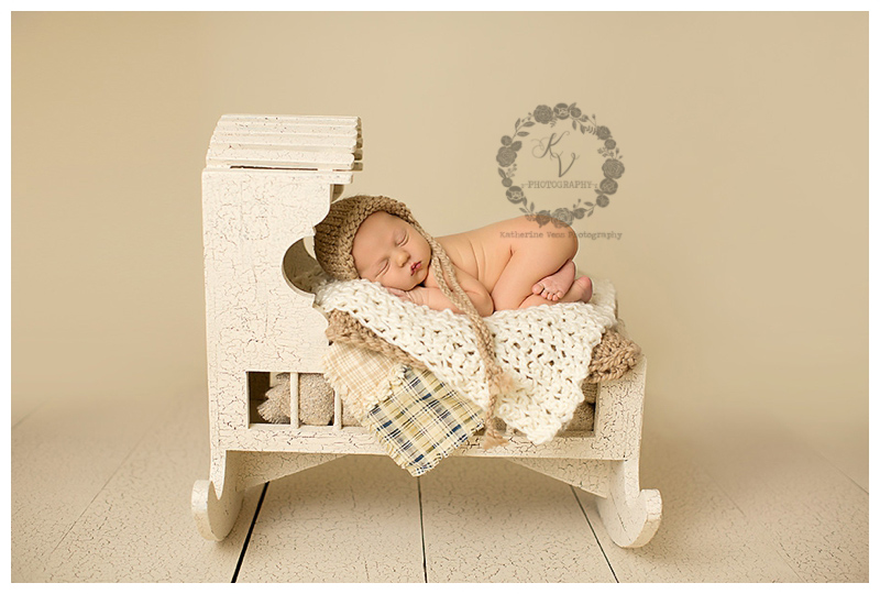 baby boy in cradle, cream setup
