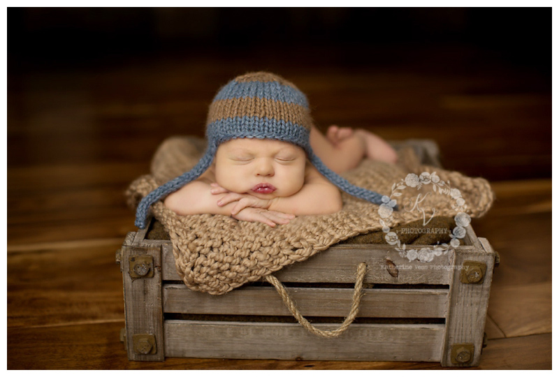 newborn in wood crate