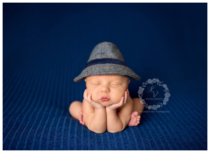 newborn baby boy in fedora hat