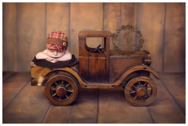 newborn in vintage wood truck