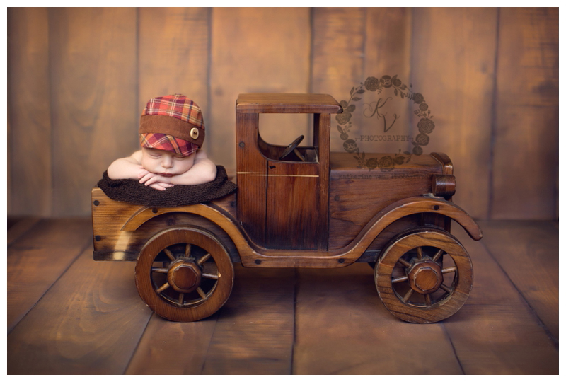 newborn in vintage wood truck