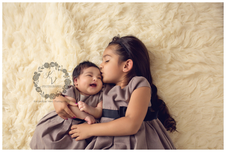 newborn sibling shot