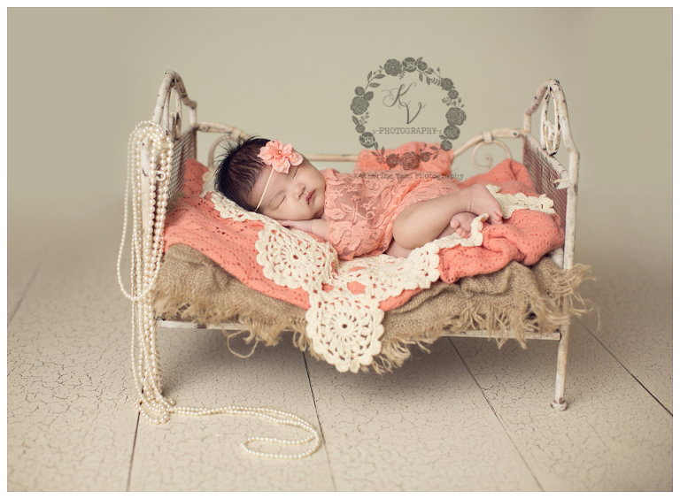pretty newborn girl on bed