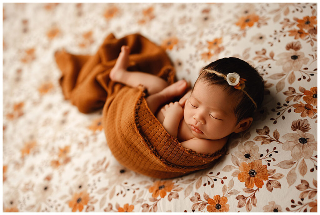 burnt orange floral wrapped baby girl