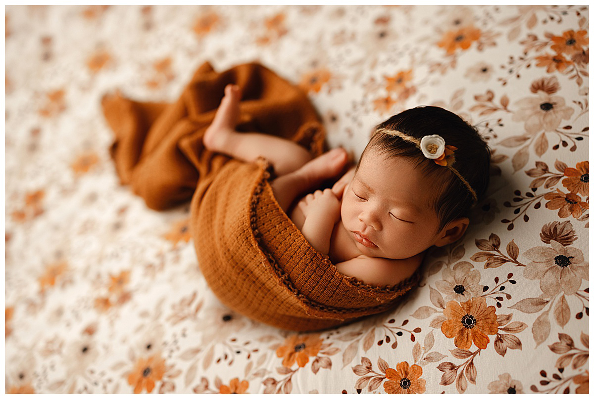 burnt orange floral wrapped baby girl
